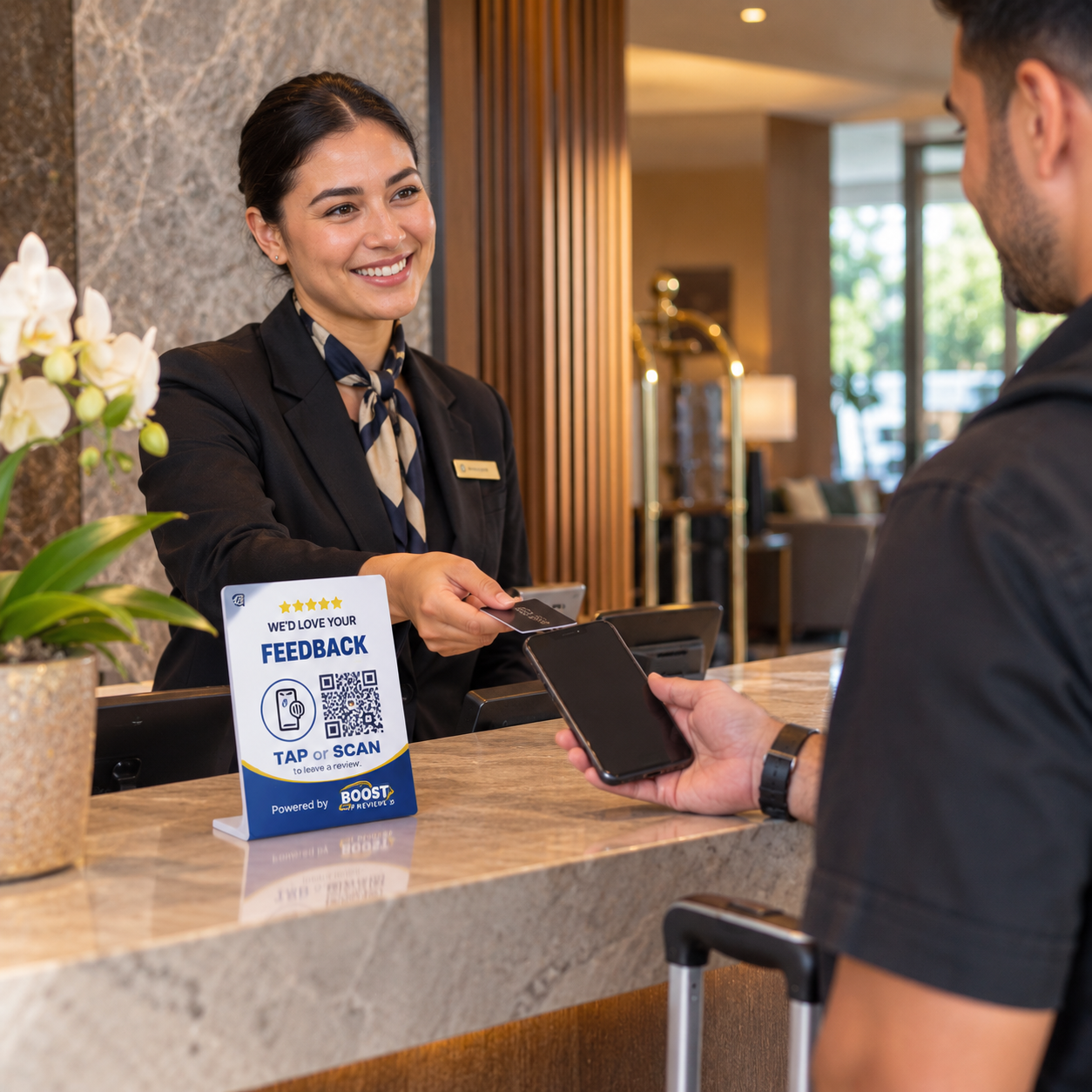Hotel guest preparing to use a Boost My Reviews counter stand while checking out.